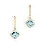 14k Yellow Gold 14k Yellow Gold Aquamarine Huggies - Three-Quarter View -  106551 - Thumbnail