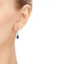 14k White Gold Blue Sapphire And Diamond Earrings - Hand View -  106062 - Thumbnail