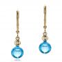 18k Yellow Gold 18k Yellow Gold Blue Topaz Cabochon And Diamond Earrings - Three-Quarter View -  100450 - Thumbnail