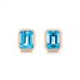 14k Rose Gold Blue Topaz Emerald Cut Stud Earrings