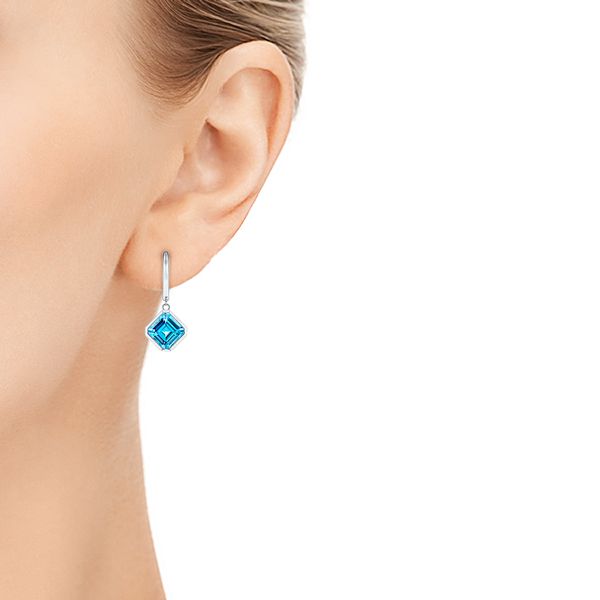 14k White Gold 14k White Gold Blue Topaz Huggie Earrings - Hand View - 106548