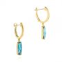 14k Yellow Gold 14k Yellow Gold Blue Topaz Huggie Earrings - Front View -  105437 - Thumbnail