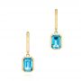 14k Yellow Gold 14k Yellow Gold Blue Topaz Huggies - Three-Quarter View -  106608 - Thumbnail