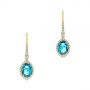 14k Yellow Gold 14k Yellow Gold Blue Topaz And Diamond Halo Earrings - Three-Quarter View -  106047 - Thumbnail
