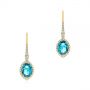 18k Yellow Gold 18k Yellow Gold Blue Topaz And Diamond Halo Earrings - Three-Quarter View -  106047 - Thumbnail