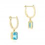 14k Yellow Gold 14k Yellow Gold Blue Topaz And Diamond Huggie Earrings - Front View -  106550 - Thumbnail