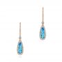 14k Rose Gold 14k Rose Gold Blue Topaz And Diamond Leverback Earrings - Three-Quarter View -  106022 - Thumbnail