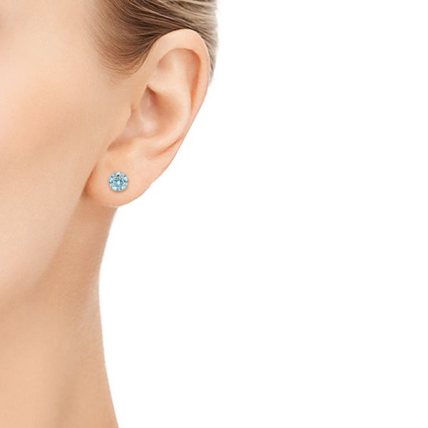  Platinum Platinum Blue Topaz And Diamond Stud Earrings - Hand View -  103728