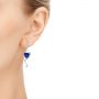  Platinum Platinum Custom Tanzanite And Diamond Earrings - Hand View -  104182 - Thumbnail