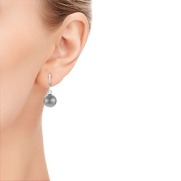  Platinum Platinum Dangle Diamond And Pearl Earrings - Hand View -  105110
