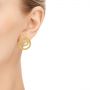 18k Yellow Gold Double Hoop Brushed Orbit Earrings - Hand View -  105808 - Thumbnail