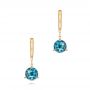 14k Yellow Gold 14k Yellow Gold London Blue Topaz Dangle Earrings - Three-Quarter View -  106405 - Thumbnail