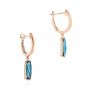 18k Rose Gold 18k Rose Gold London Blue Topaz Huggie Earrings - Front View -  105408 - Thumbnail