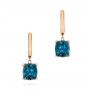 14k Rose Gold 14k Rose Gold London Blue Topaz Huggies - Three-Quarter View -  106004 - Thumbnail