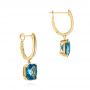 14k Yellow Gold London Blue Topaz Huggies - Front View -  106004 - Thumbnail