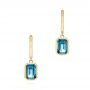 18k Yellow Gold 18k Yellow Gold London Blue Topaz Huggies - Three-Quarter View -  106607 - Thumbnail