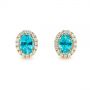 14k Yellow Gold 14k Yellow Gold Oval Blue Zircon And Diamond Halo Earrings - Three-Quarter View -  105010 - Thumbnail