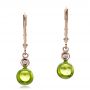 14k Rose Gold 14k Rose Gold Peridot Cabochon And Diamond Earrings - Three-Quarter View -  100448 - Thumbnail