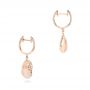 14k Rose Gold Pink Mother Of Pearl And Diamond Venus Twist Earrings - Front View -  102490 - Thumbnail