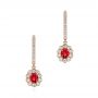 14k Rose Gold 14k Rose Gold Ruby And Diamond Halo Earrings - Three-Quarter View -  106453 - Thumbnail