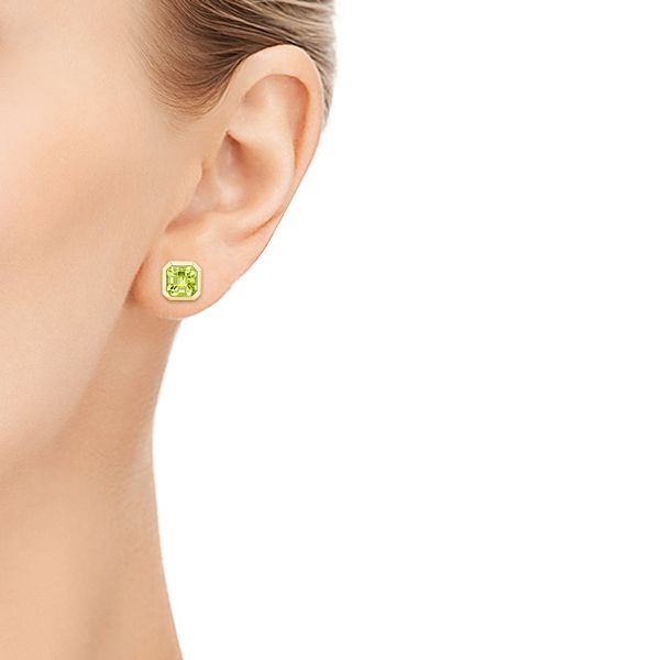 14k Yellow Gold Step Cut Peridot Stud Earrings - Hand View - 106035