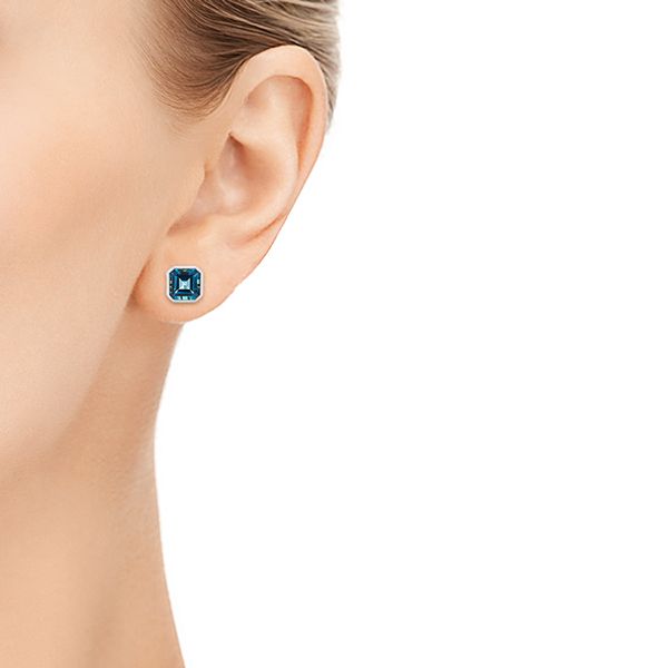  Platinum Platinum Step-cut London Blue Topaz Stud Earrings - Hand View -  105997