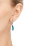 14k White Gold Teardrop Blue Topaz And Diamond Drop Earrings - Hand View -  105429 - Thumbnail