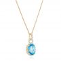 18k Yellow Gold 18k Yellow Gold Oval Blue Topaz And Diamond Halo Pendant - Flat View -  102612 - Thumbnail