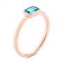 14k Rose Gold 14k Rose Gold Blue Topaz Emerald Cut Fashion Ring - Three-Quarter View -  105436 - Thumbnail