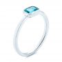 18k White Gold 18k White Gold Blue Topaz Emerald Cut Fashion Ring - Three-Quarter View -  105436 - Thumbnail