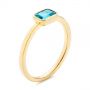 14k Yellow Gold 14k Yellow Gold Blue Topaz Emerald Cut Fashion Ring - Three-Quarter View -  105436 - Thumbnail