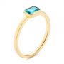 14k Yellow Gold 14k Yellow Gold Blue Topaz Emerald Cut Fashion Ring - Three-Quarter View -  105436 - Thumbnail