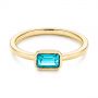 14k Yellow Gold 14k Yellow Gold Blue Topaz Emerald Cut Fashion Ring - Flat View -  105436 - Thumbnail