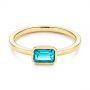 14k Yellow Gold 14k Yellow Gold Blue Topaz Emerald Cut Fashion Ring - Flat View -  105436 - Thumbnail