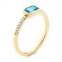 14k Yellow Gold 14k Yellow Gold Emerald Cut Blue Topaz And Diamond Fashion Ring - Three-Quarter View -  105435 - Thumbnail