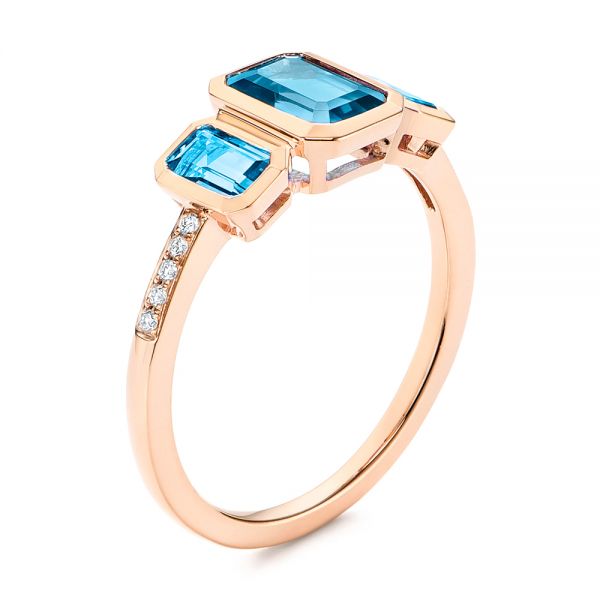 14k Rose Gold 14k Rose Gold Emerald Cut Blue Topaz And Diamond Three-stone Ring - Three-Quarter View - 106024