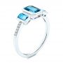 14k White Gold Emerald Cut Blue Topaz And Diamond Three-stone Ring - Three-Quarter View -  106024 - Thumbnail