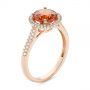 14k Rose Gold 14k Rose Gold Spessartite Garnet And Diamond Halo Ring - Three-Quarter View -  105016 - Thumbnail