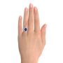  Platinum Custom Blue Sapphire And Diamond Halo Engagement Ring - Hand View -  102018 - Thumbnail