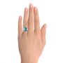  Platinum Custom Blue Zircon And Diamond Halo Engagement Ring - Hand View -  102344 - Thumbnail