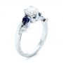 14k White Gold 14k White Gold Custom Three Stone Blue Sapphire And Diamond Hand Engraved Engagement Ring - Three-Quarter View -  103488 - Thumbnail