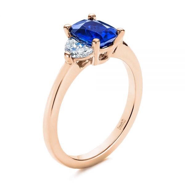 18k Rose Gold 18k Rose Gold Three Stone Blue Sapphire And Half Moon Diamond Engagement Ring - Three-Quarter View -  105829